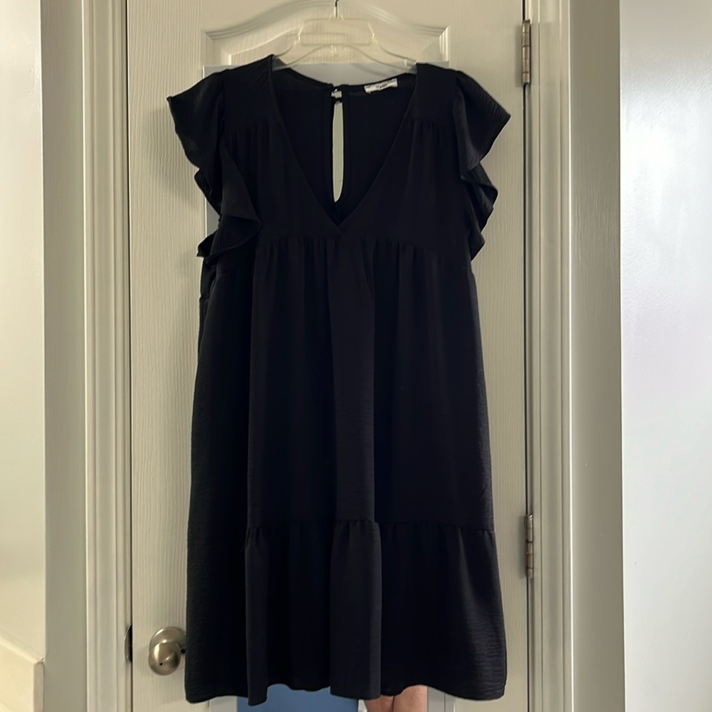 Women’s black lined dress. Bell sleeves.